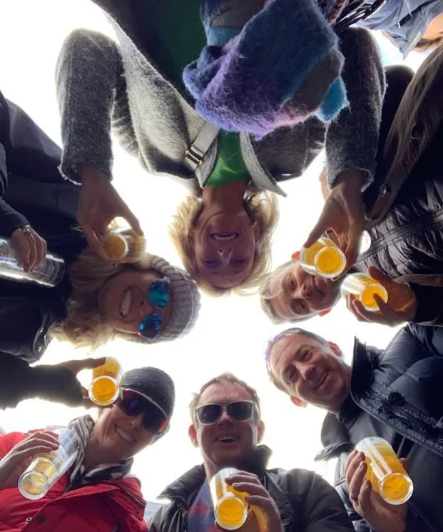 T3 members celebrating together after their Flanders ride